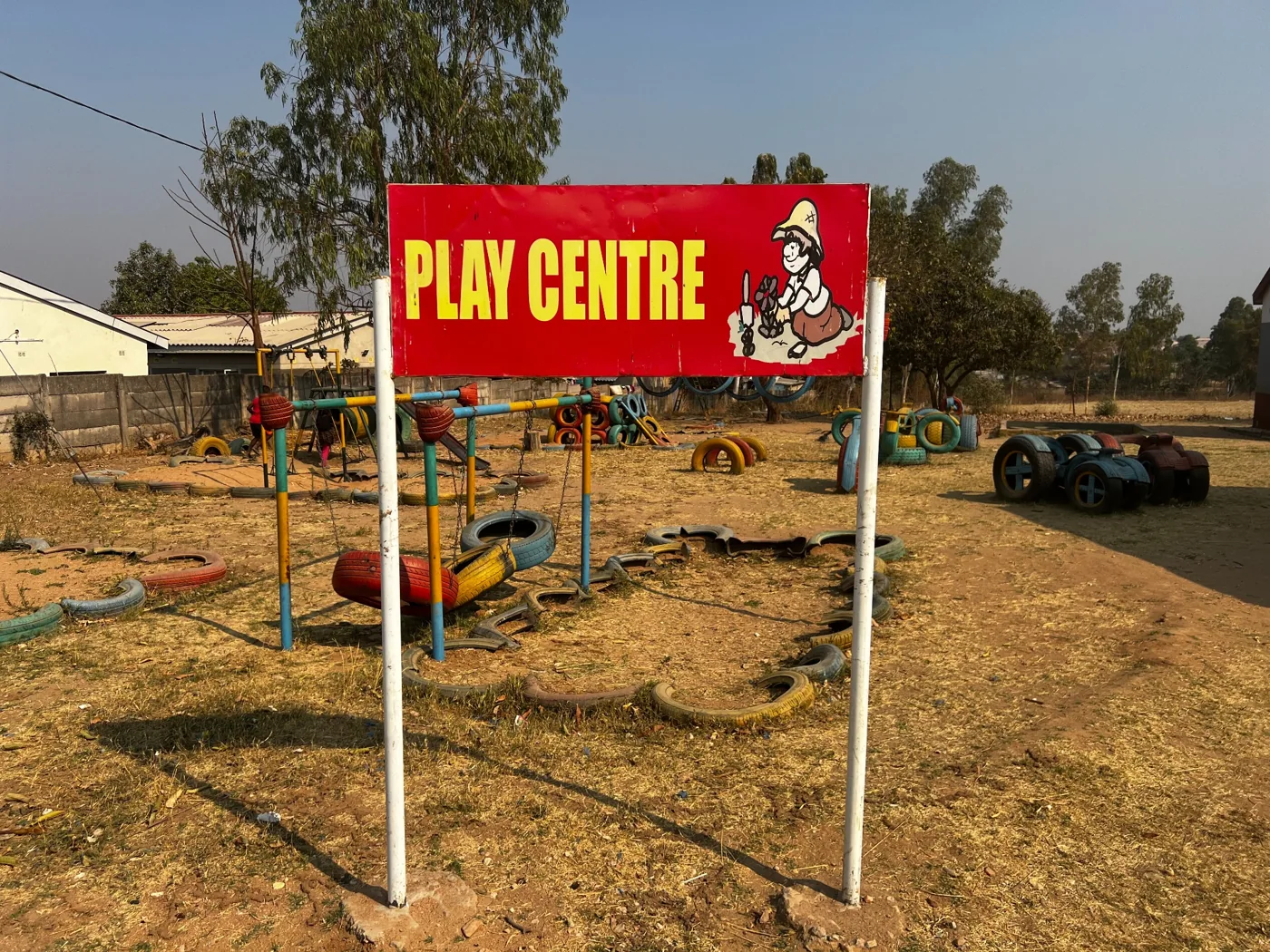 The school play centre sign and outdoor play area